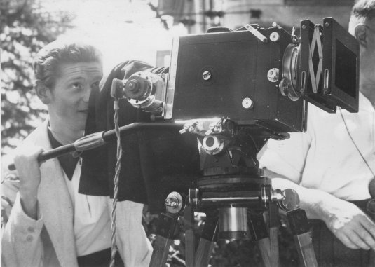 Cinematographer Fred R. Krug shooting newsreels in Switzerland